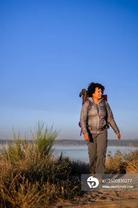 U.S. Army female soldier putting in the miles with an early morning hike in the NorthWest.