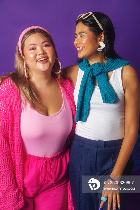 Asian duo fashion colour-blocked studio portrait