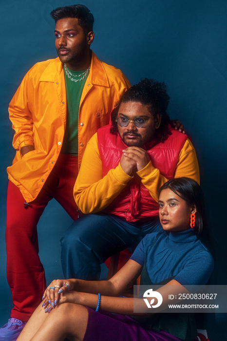 Asian trio colour blocked fashion studio portrait