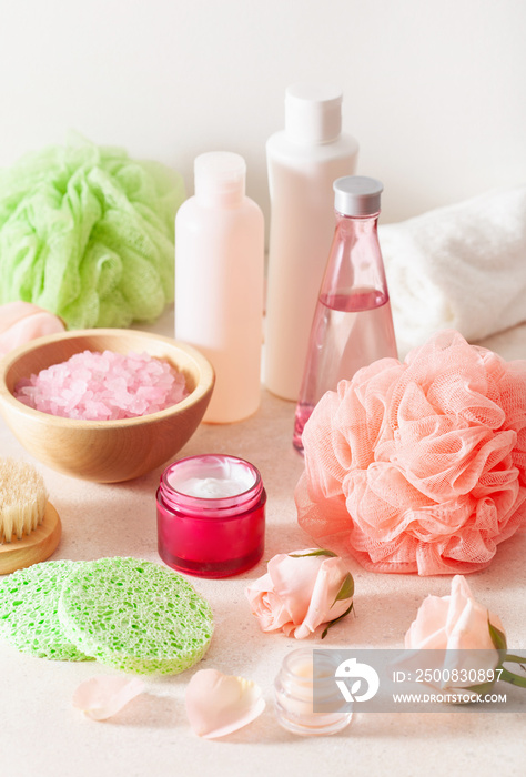 skincare products and rose flowers. natural cosmetics for home spa treatment