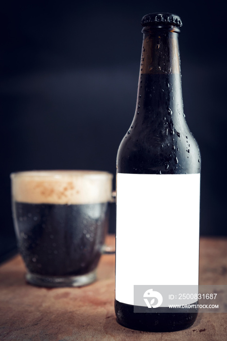 Bottle of dark beer with blank label for your ads