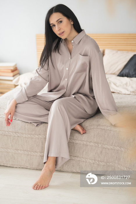 beautiful brunette adult girl in femine pajamas sleep wear homewear at home lifestyle