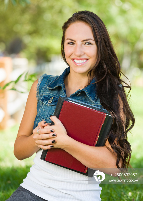 Attractive Smiling Mixed Race Young Girl Student with School Books Outdoors