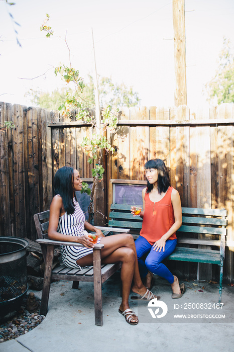 Friends chatting at garden party