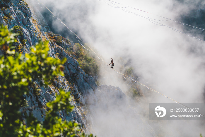 Highliner goes on a sling above the clouds.