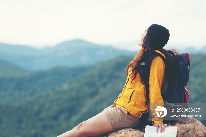 Woman travel  hiker adventure on mountain nature landscape.  Asia lifestyle tourist girl backpack sitting with map to find directions explore and camping outdoors for relax summer time.  