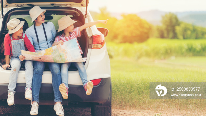 Group asian family children checking map and pointing on the car adventure and tourism for destination and leisure trips travel for education and relax in nature park.