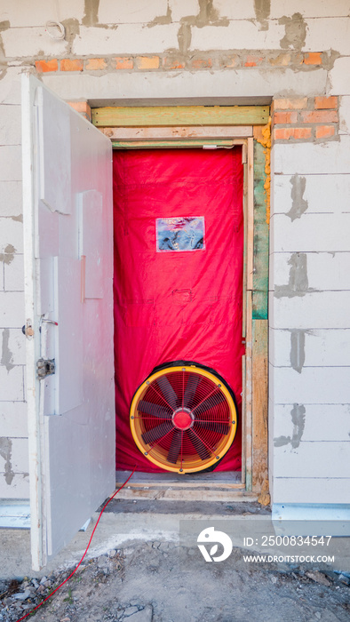 Blower door test: Testing the house for airtightness, on the front door installed a powerful fan.