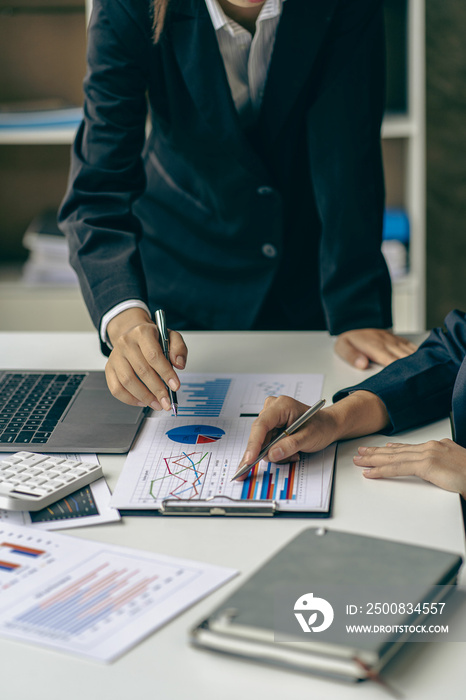 An accountant uses a calculator and computer while sticking to the concept of business accounting. Budget and Loan Hands of people making money and calculating expenses at the office vertical picture