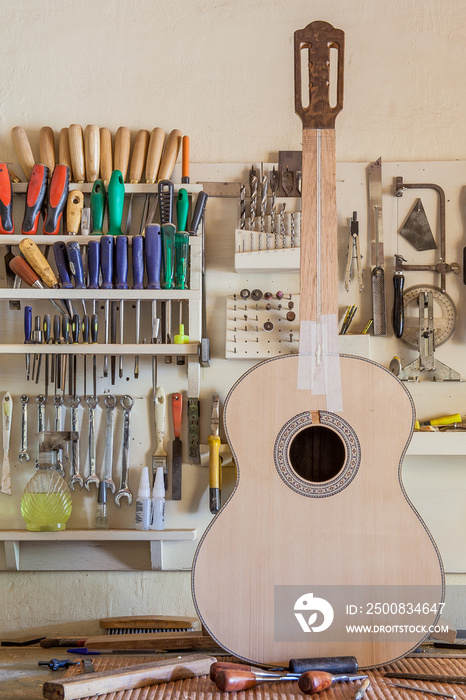 Classical guitar under construction in luthier workshop