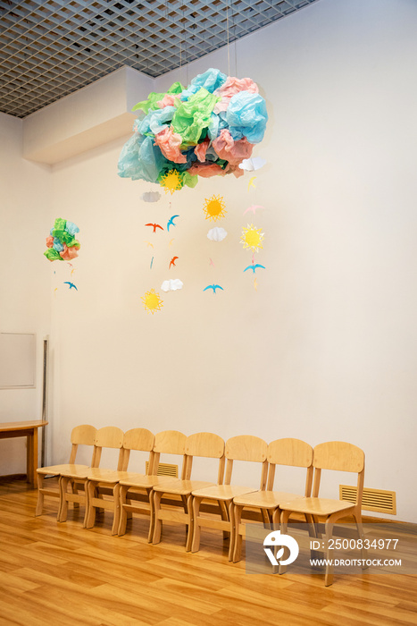 children’s wooden stools stand in kindergarten