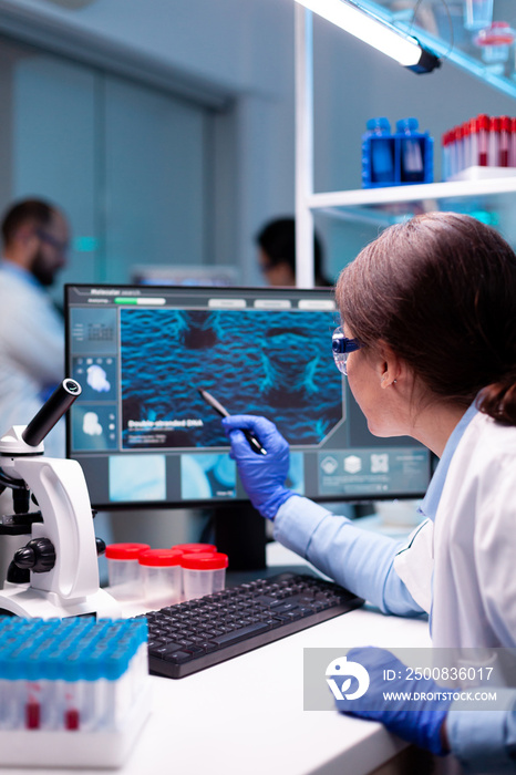 Biochemist scientist working on the laboratory to discovery a technology for a virus. Chemistry research and analysing in science medicine lab developing and stying new type of vaccin.