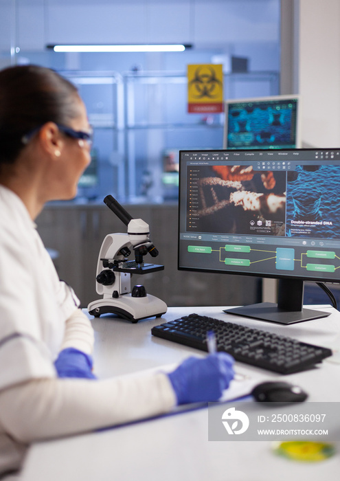 Specialist doctor analyzing virus expertise writing on clipboard during biomedical experiment in hospital laboratory, Biologist researcher working at vaccine development. Healthcare treatment