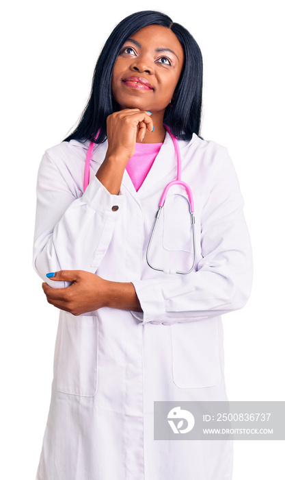 Young african american woman wearing doctor stethoscope with hand on chin thinking about question, pensive expression. smiling and thoughtful face. doubt concept.