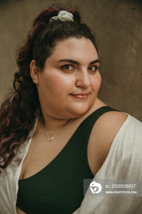 closeup portrait of a plus size jewish woman with serious expression