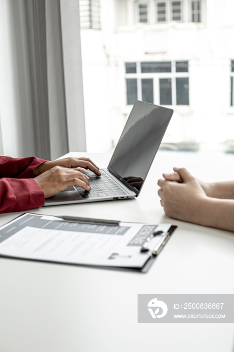 The HR department is typing a laptop to fill out the applicant’s information after being interviewed by the department manager and accepting jobs for the job applicant. Job application ideas