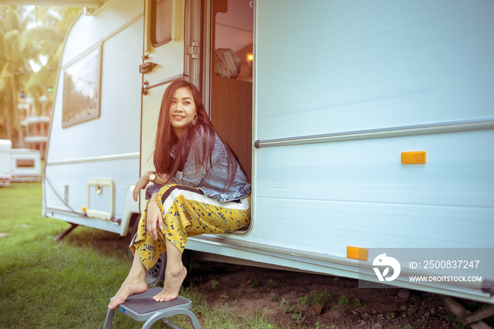 Young asian woman in a camper van