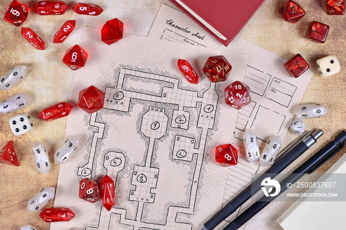 Roleplaying game dices on hand drawn dungeon adventure map. Concept for table top role playing games