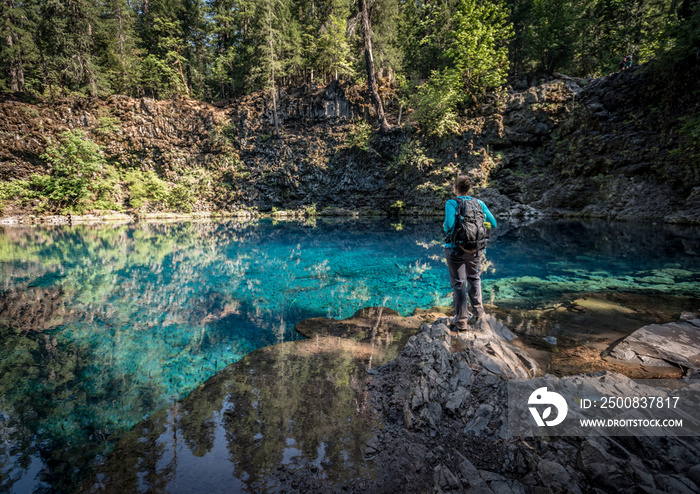 Woman Stands Over Blue Pool