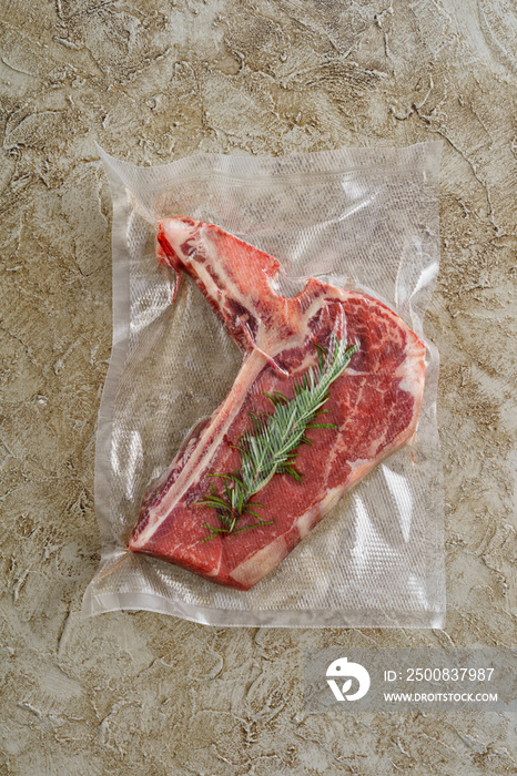 Lamb chop sealed in an airtight plastic bag ready for sous vide cooking