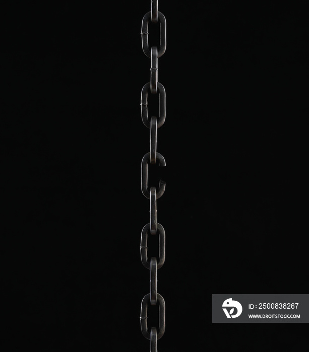 broken link metal chain isolated on black background