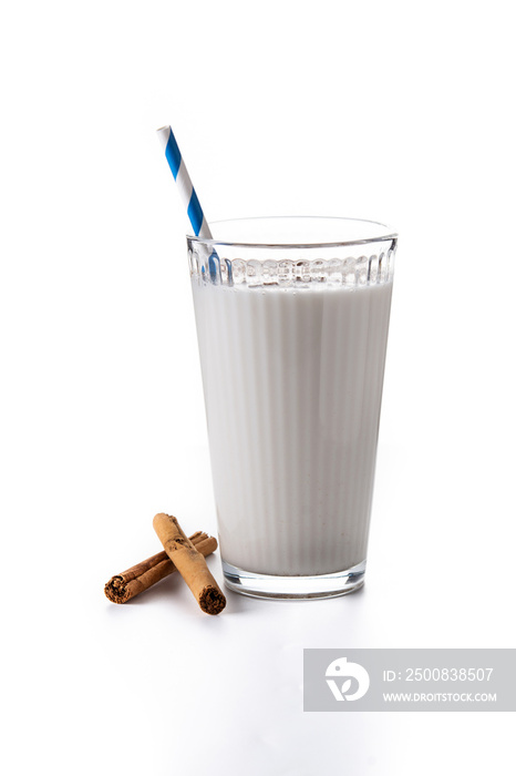 Fresh horchata with cinnamon in glass isolated on white background