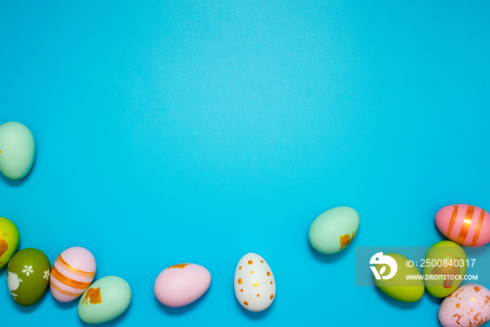 Easter Eggs. Colorful Easter eggs on blue background with copy space