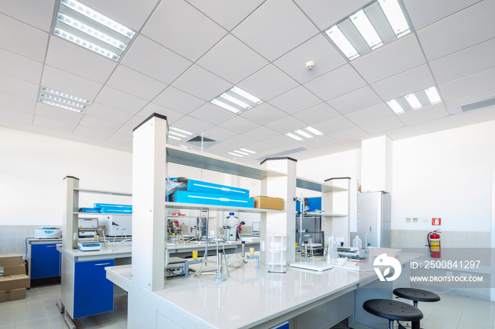 Scientific laboratory room with microscopes.