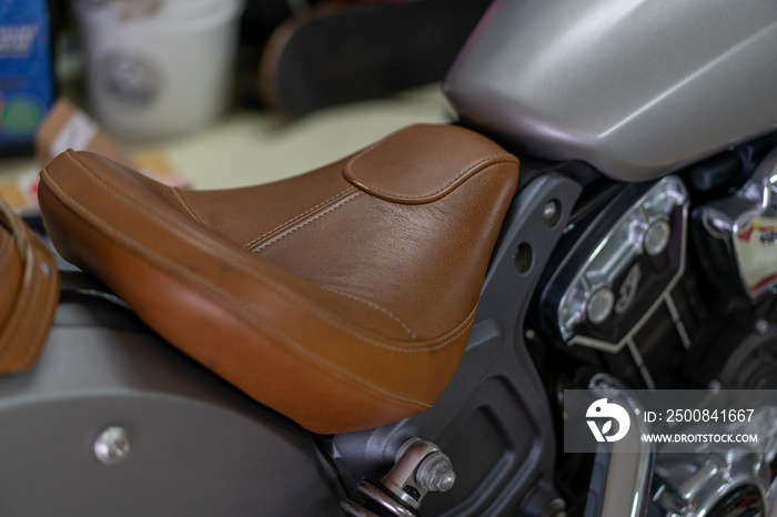 view of Indian Scout motorbike brown leather seat