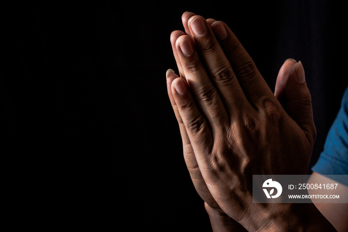 Praying hand Prayer requests for what is intended Or is less likely Is a wish from Holy things or gods, Hand on black background