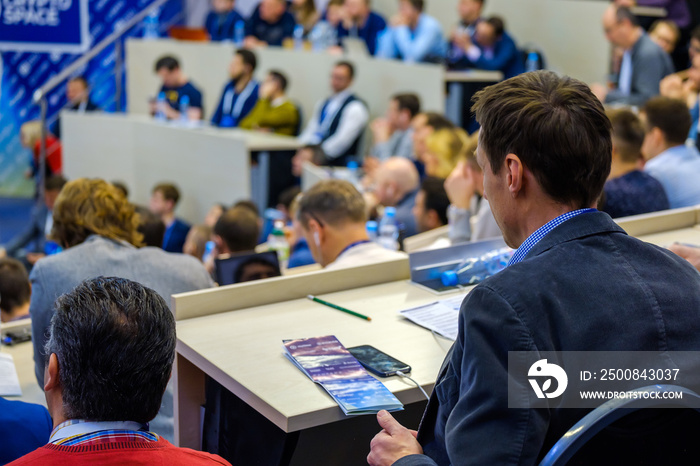 People attend business conference in the congress hall