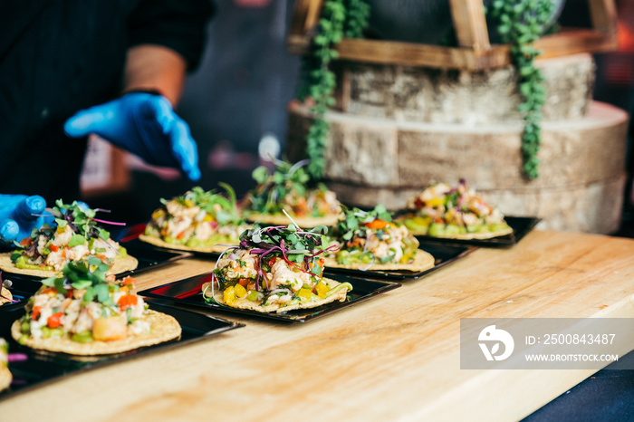 person serving tacos