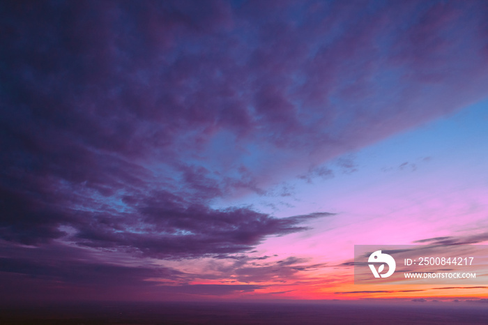 Colorful cloudy sky at sunset. Gradient color. Sky texture. Abstract nature background