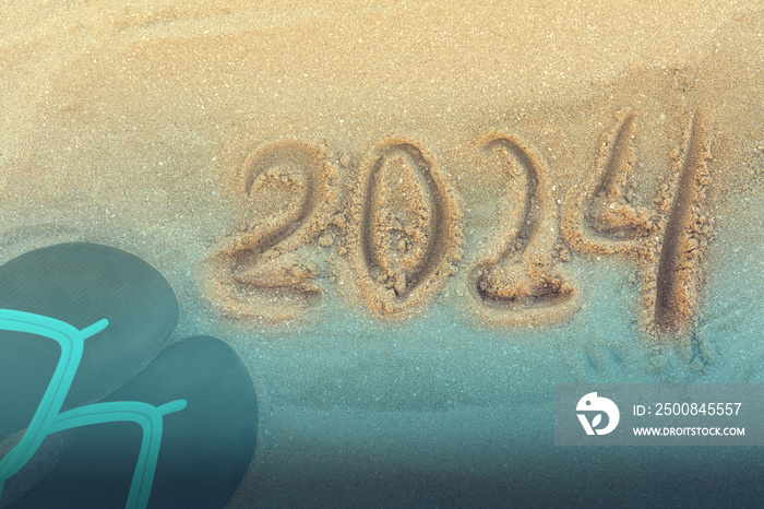 Happy New Year 2024, lettering message handwritten on the beach Numbers 2024 year sand background