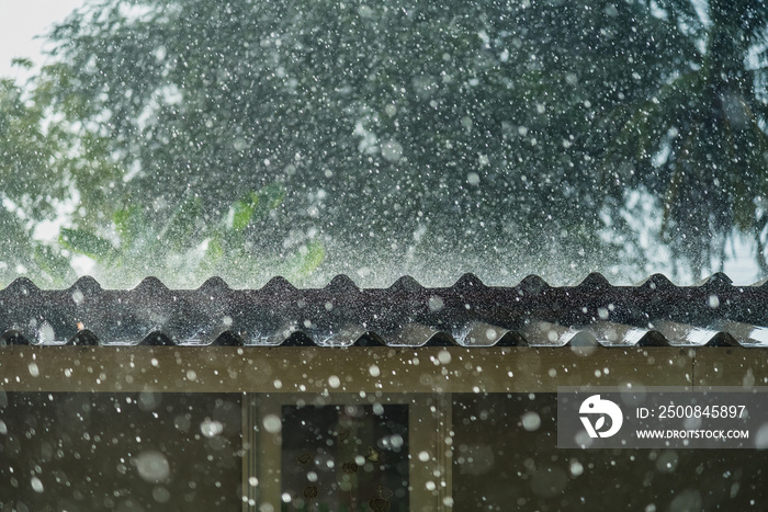 Storm rain on the roof of the house.