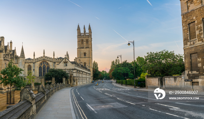 High street panorama at dawn with Magdalen bell tower in Oxford. England