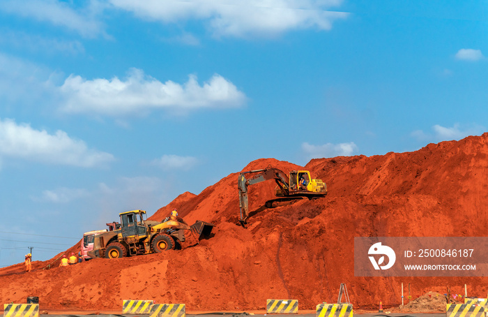 Road construction site with diggers and trucks, Mozambique