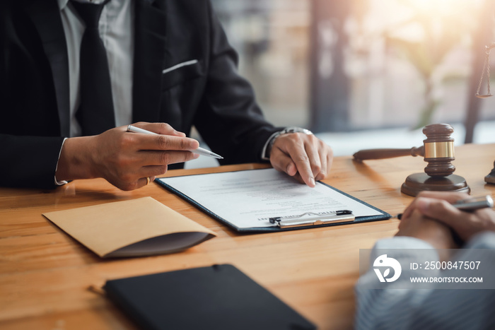 Businessman and lawyer discuss the contract document. Treaty of the law. Sign a contract business.