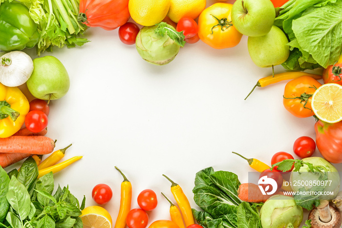 Frame made of fresh vegetables and fruits on white background