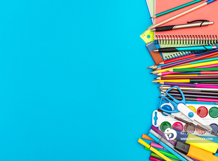 Frame from school supplies on blue background. Education background.