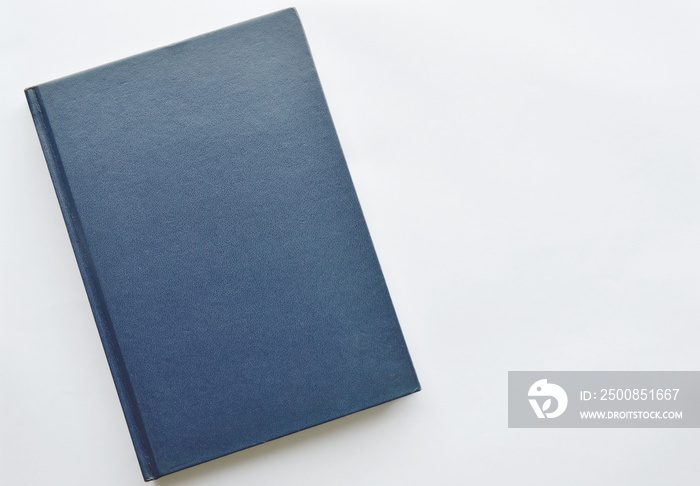 blue hard cover book on white background