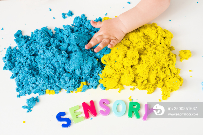 Sensory word and magic kinetic sand. Early sensory education. Kidd’s sensory experiences, games and play for fine motor skills. Therapy hand, development of fine motor, autism, occupational therapy