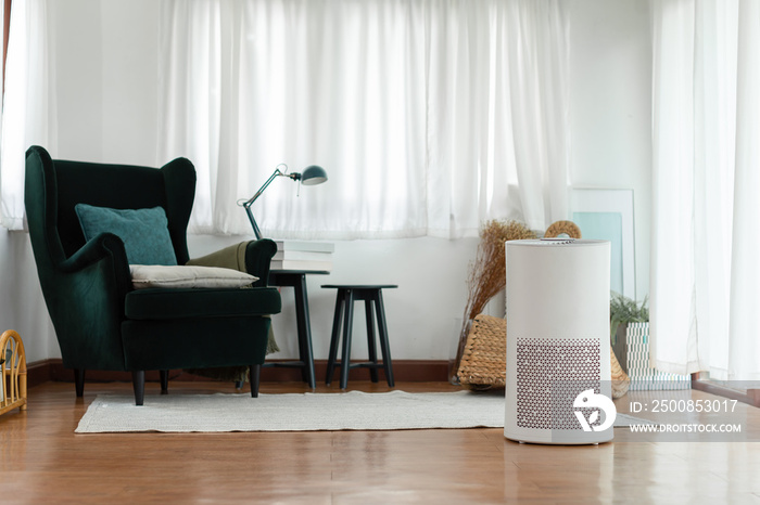 Air purifier in cozy white Living room for filter and cleaning removing dust PM2.5 HEPA in home,for fresh air and healthy life, Air Pollution Concept