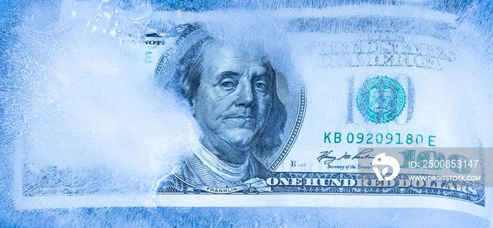 100 US dollar frozen under a layer of ice