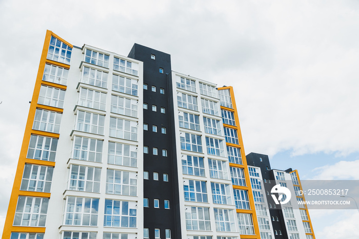 New modern multi-storey residential building. Plastic windows in a new apartment. Apartment with a balcony.