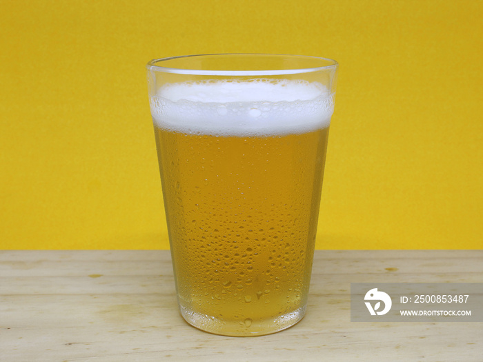 Cold beer in a traditional glass cup