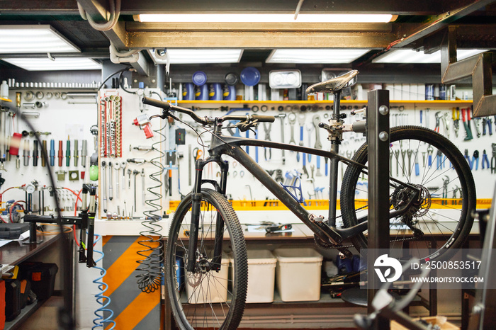 Bicycle on rack in workshop