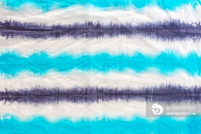 striped tie dye pattern on cotton fabric abstract background.