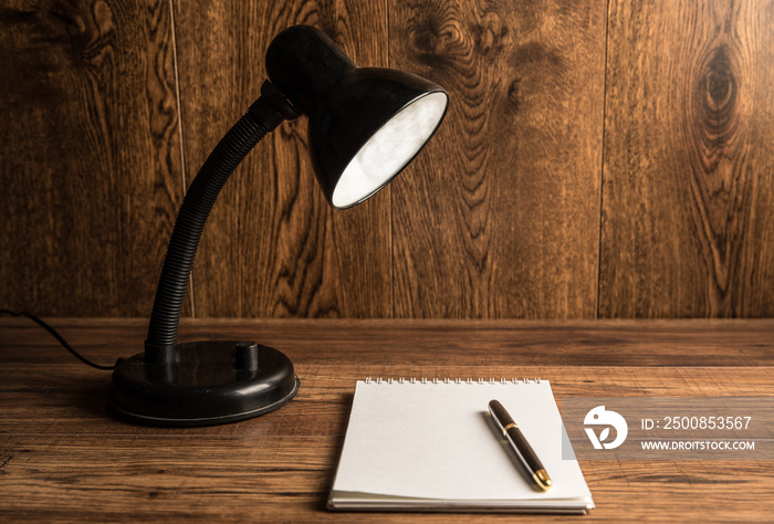 Table lamp and notebook