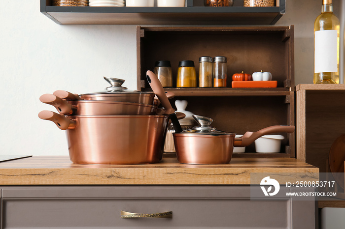 Set of kitchen utensils on counter in modern kitchen